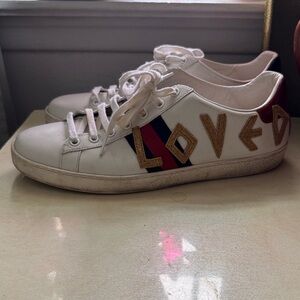 Gucci White Sneakers with Gold and Black Accents